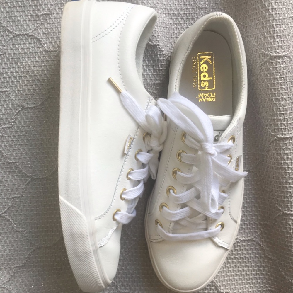 Keds tennis shoes lace up with gold grommets